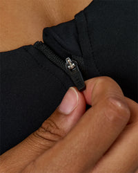 Woman wearing Elarra Zip Front Sports Bra - Black | Model:Rosie | Size:S