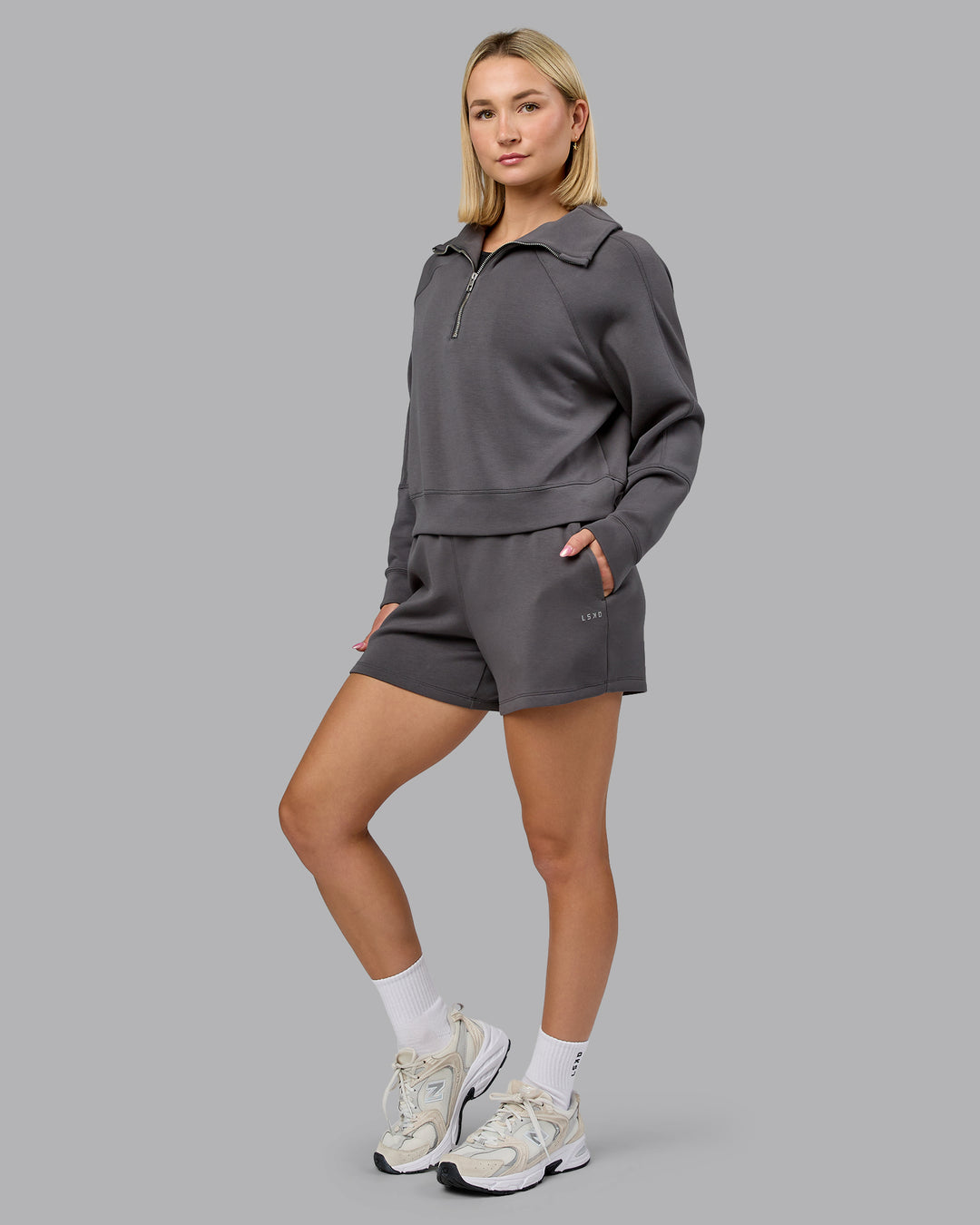 Woman wearing Elevate SoftTouch 1/2 Zip Sweater - Asphalt | Model:Halle | Size:S