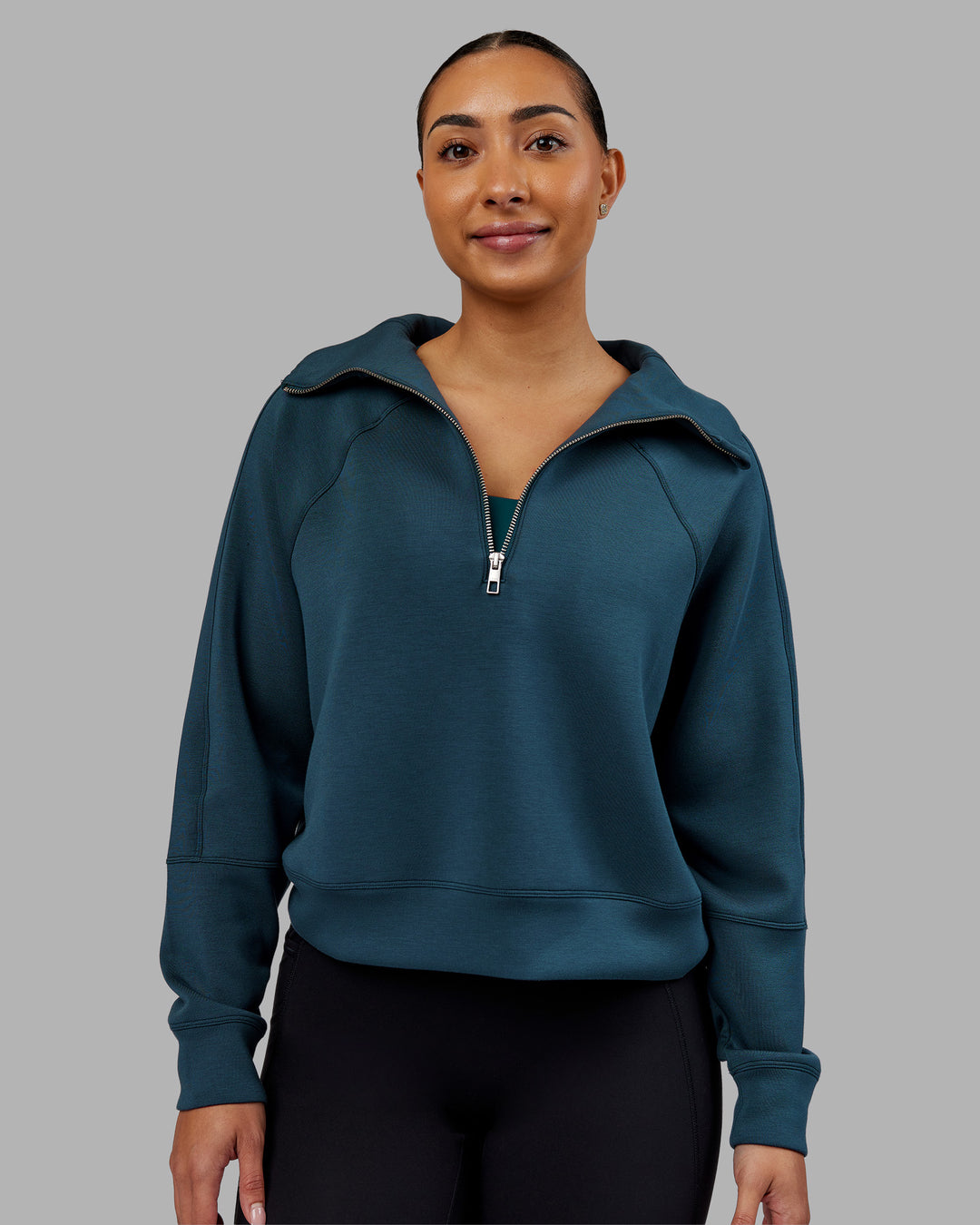 Woman wearing Elevate SoftTouch 1/2 Zip Sweater - Deep Sea | Model:Ayla | Size:S