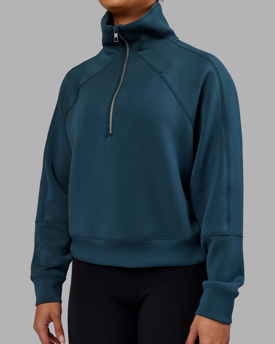 Woman wearing Elevate SoftTouch 1/2 Zip Sweater - Deep Sea | Model:Ayla | Size:S