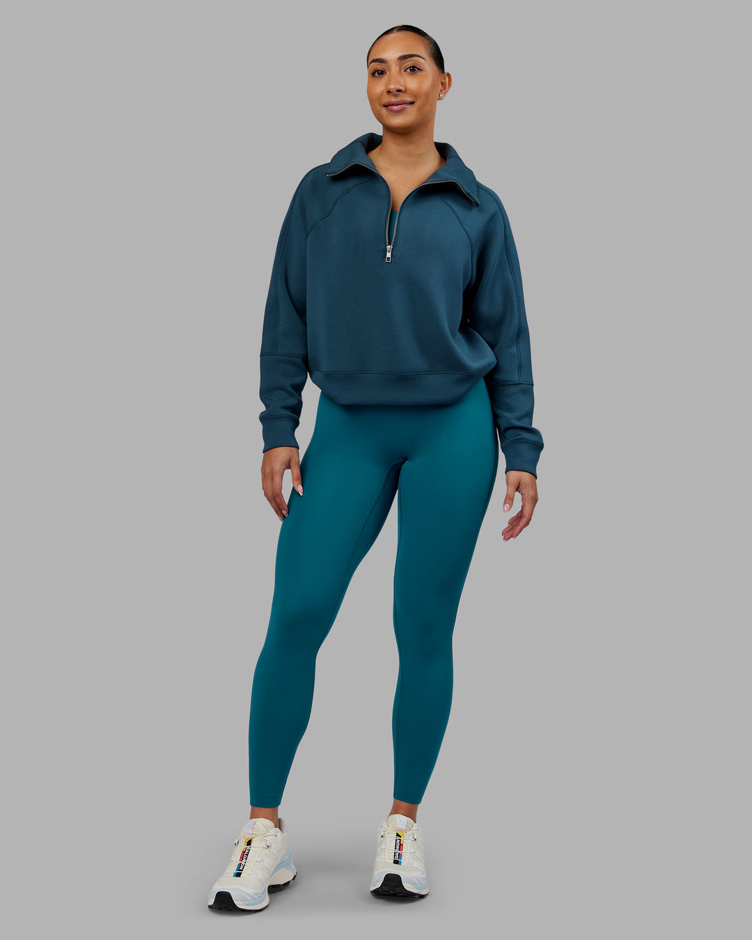 Woman wearing Elevate SoftTouch 1/2 Zip Sweater - Deep Sea | Model:Ayla | Size:S