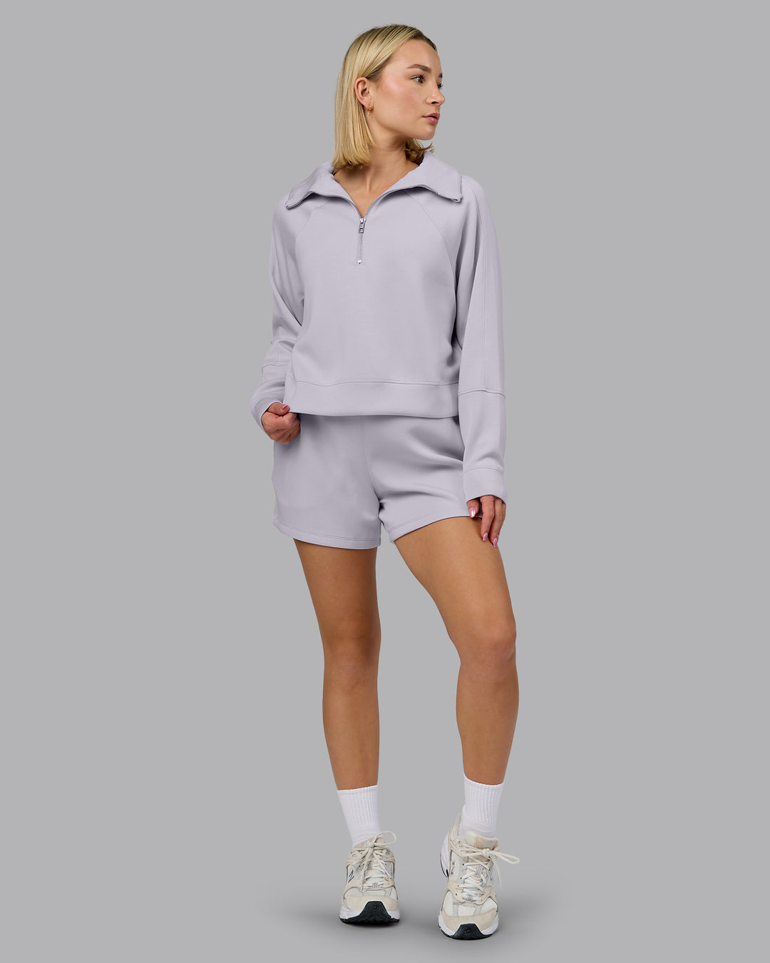 Woman wearing Elevate SoftTouch 1/2 Zip Sweater - Galactic Lilac | Model:Halle | Size:S