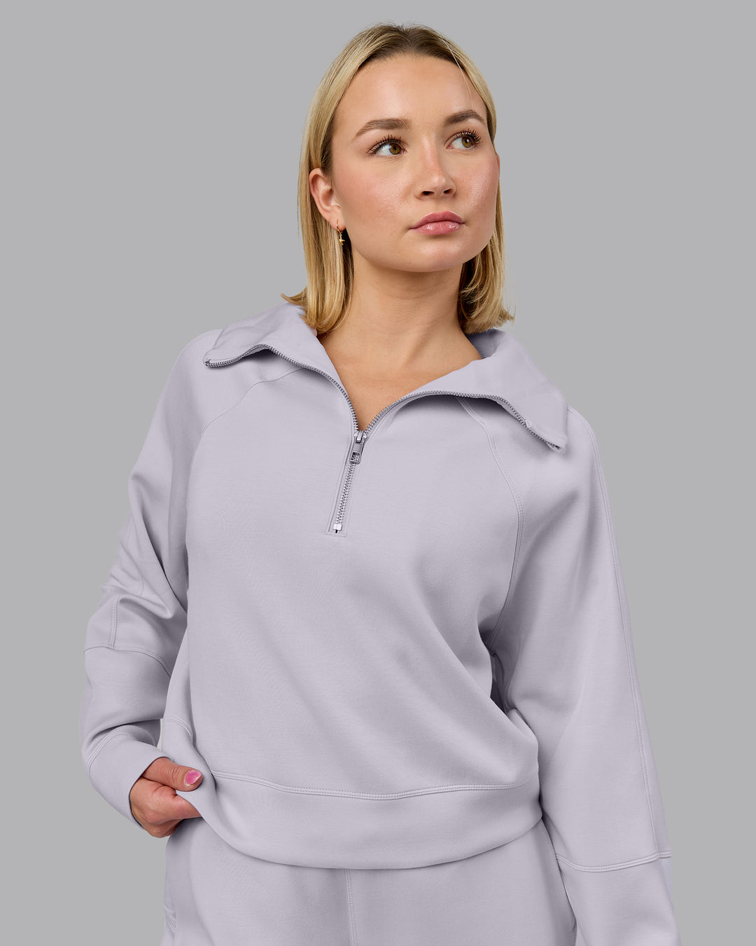 Woman wearing Elevate SoftTouch 1/2 Zip Sweater - Galactic Lilac | Model:Halle | Size:S