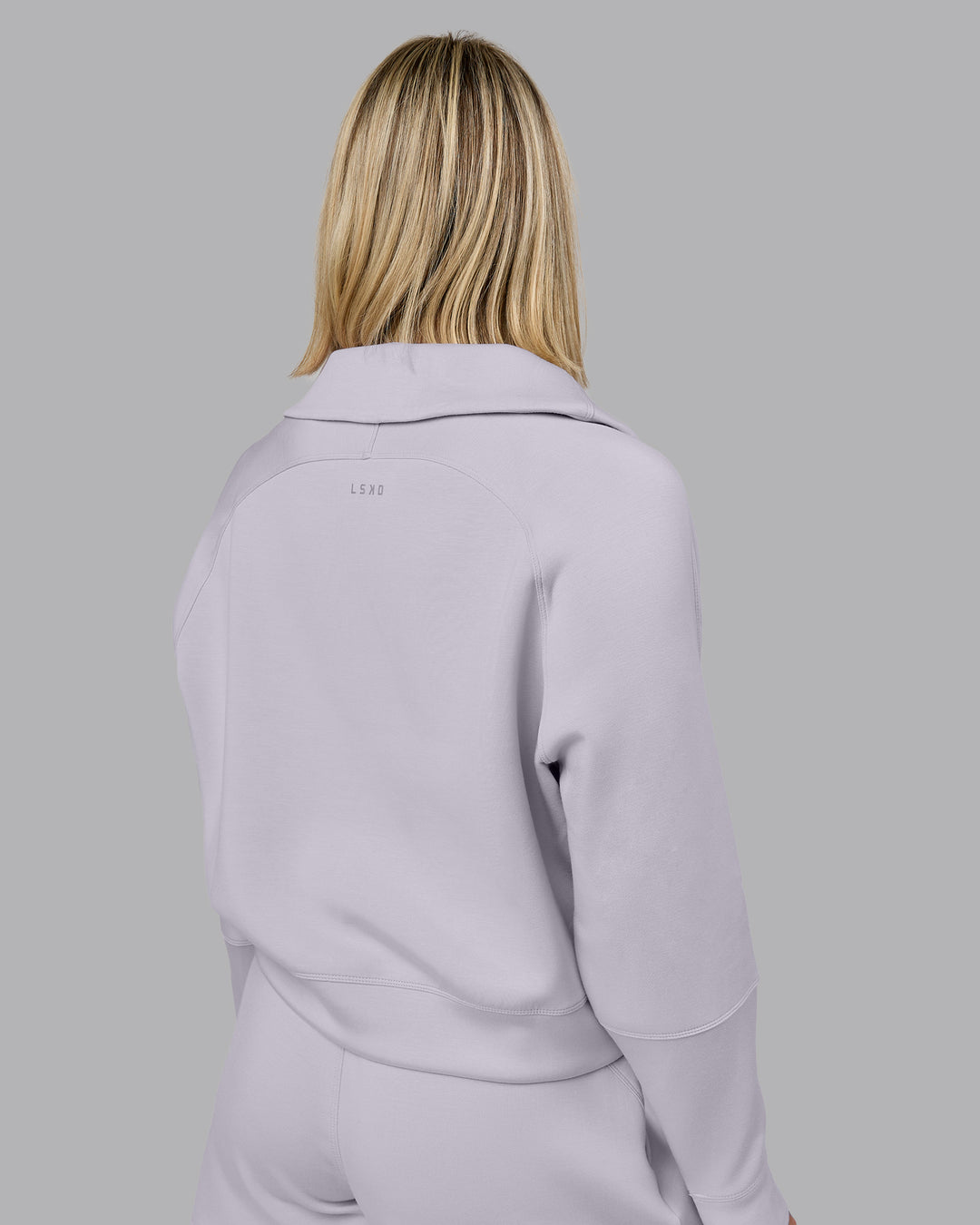 Woman wearing Elevate SoftTouch 1/2 Zip Sweater - Galactic Lilac | Model:Halle | Size:S