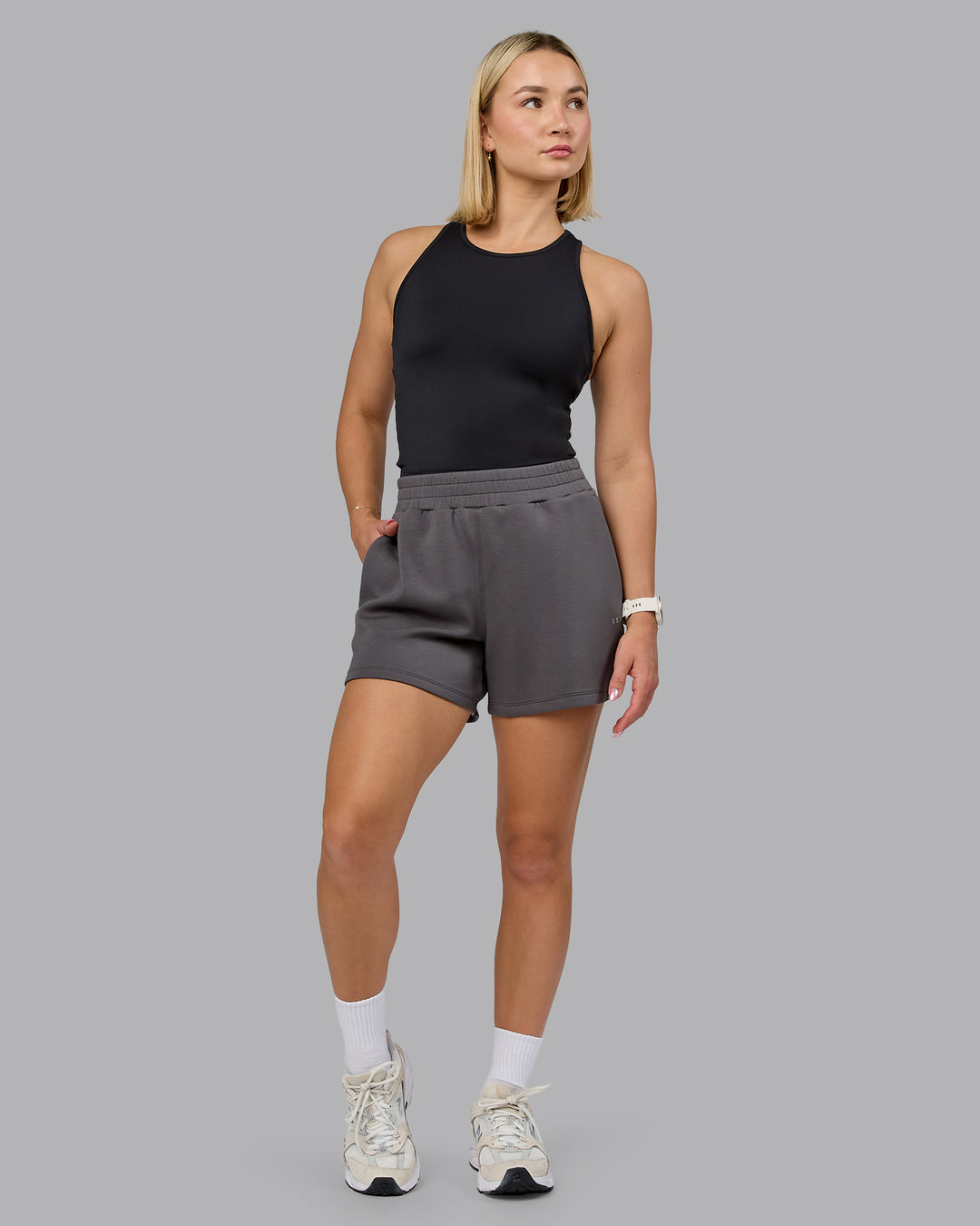 Woman wearing Elevate SoftTouch 4&quot; Short - Asphalt | Model:Halle | Size:S