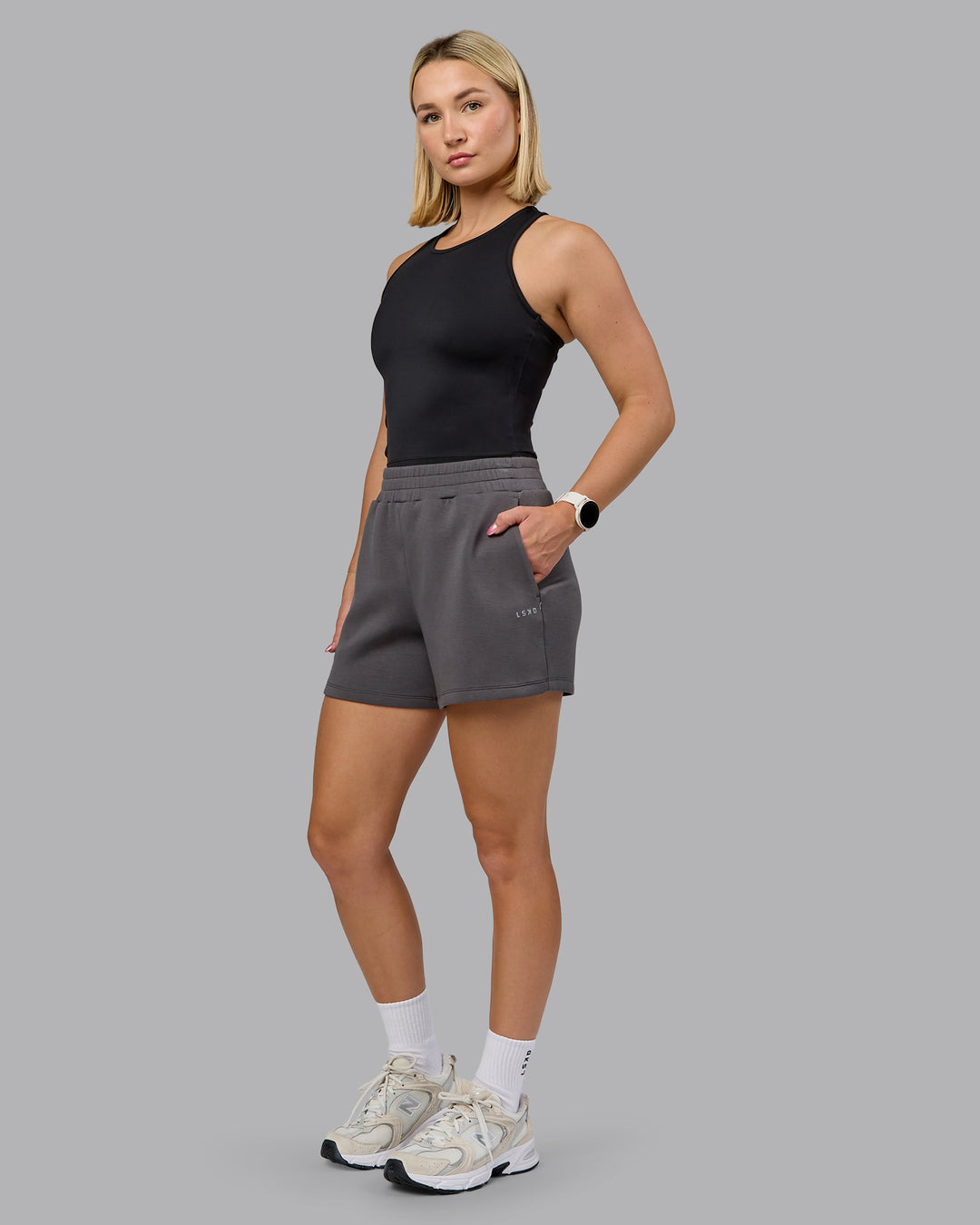 Woman wearing Elevate SoftTouch 4&quot; Short - Asphalt | Model:Halle | Size:S