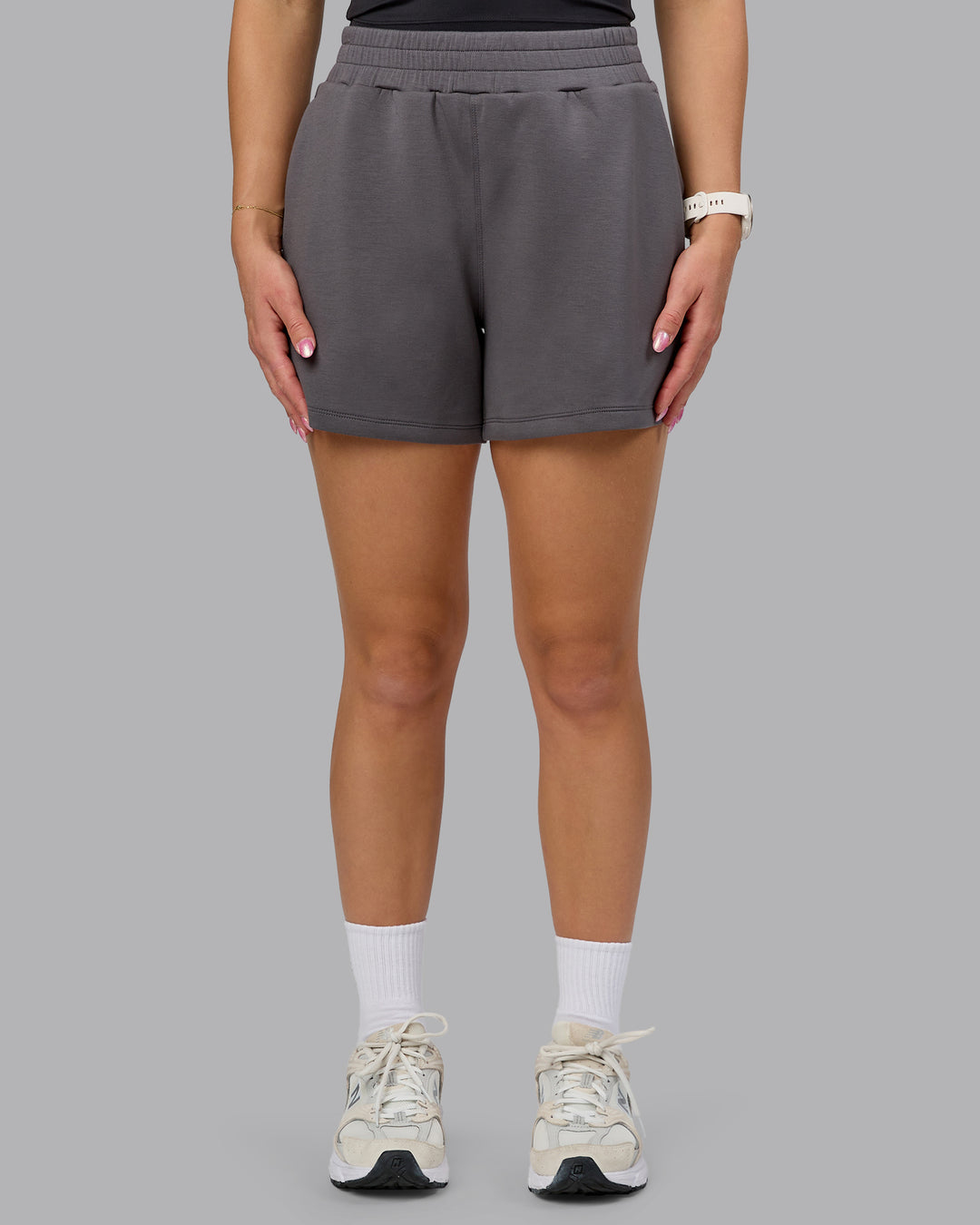 Woman wearing Elevate SoftTouch 4&quot; Short - Asphalt | Model:Halle | Size:S