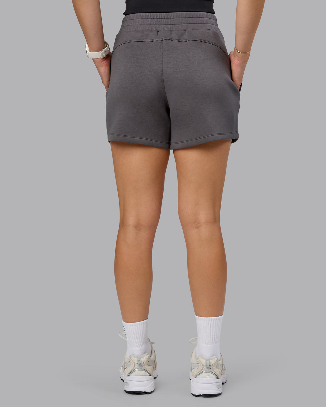 Woman wearing Elevate SoftTouch 4&quot; Short - Asphalt | Model:Halle | Size:S