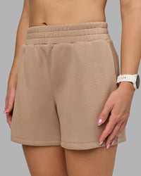 Woman wearing Elevate SoftTouch 4" Short - Light Taupe | Model:Halle | Size:S