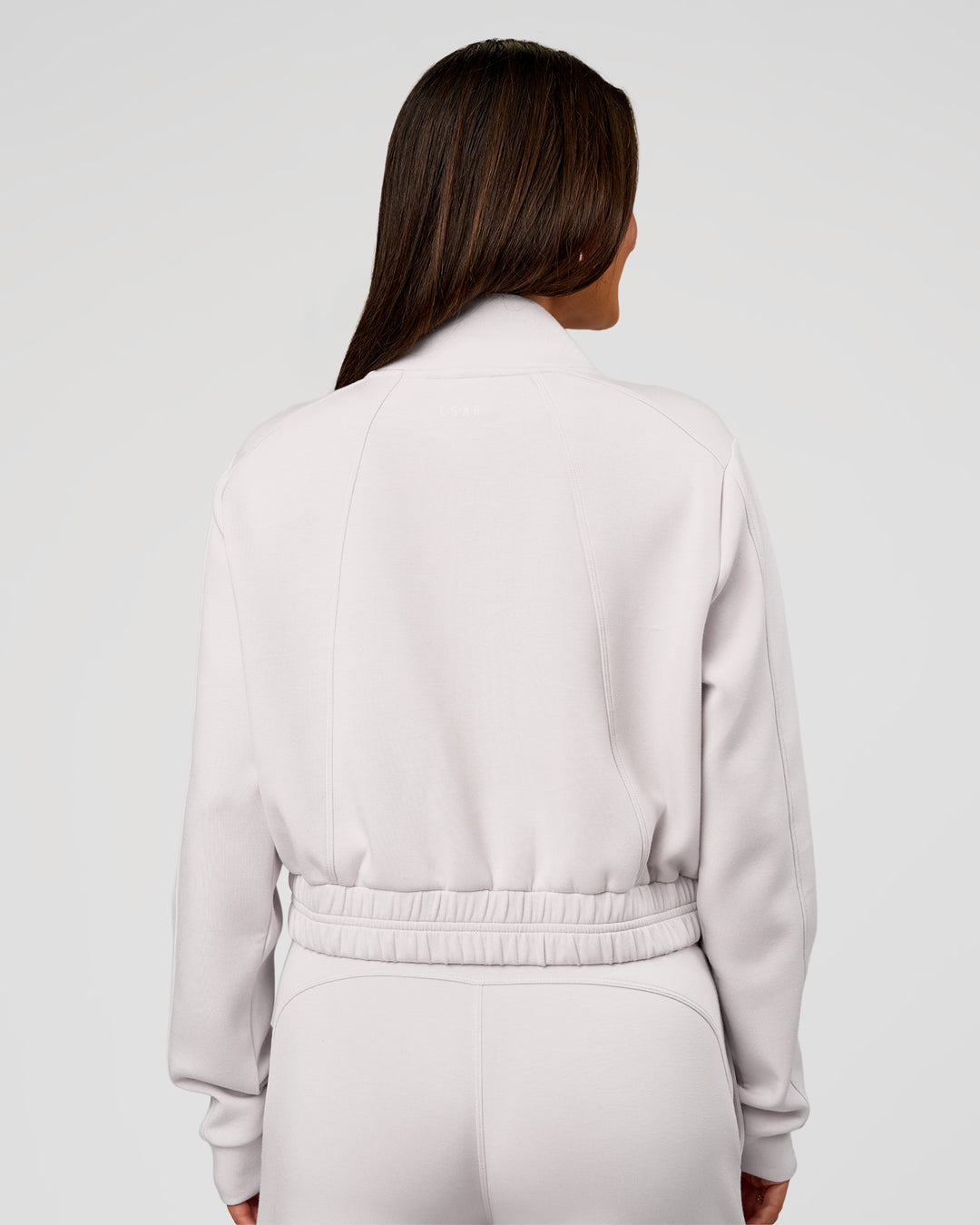 Woman wearing Elevate SoftTouch Cropped Full Zip Jacket - Clay | Model:Bianca | Size:S