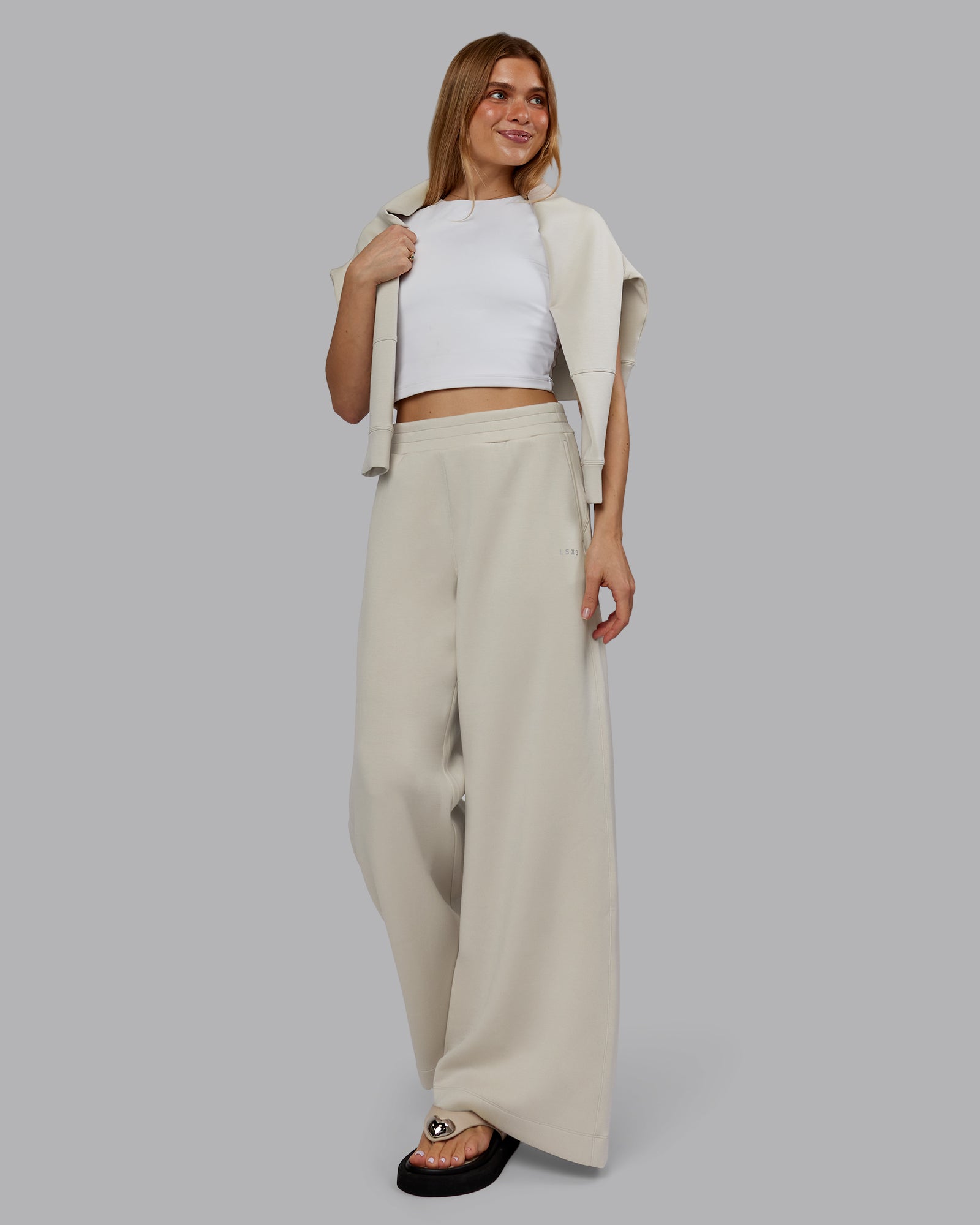 Woman wearing Elevate SoftTouch Wide Leg Pant - Shale Beige | Model:Emilie | Size:S