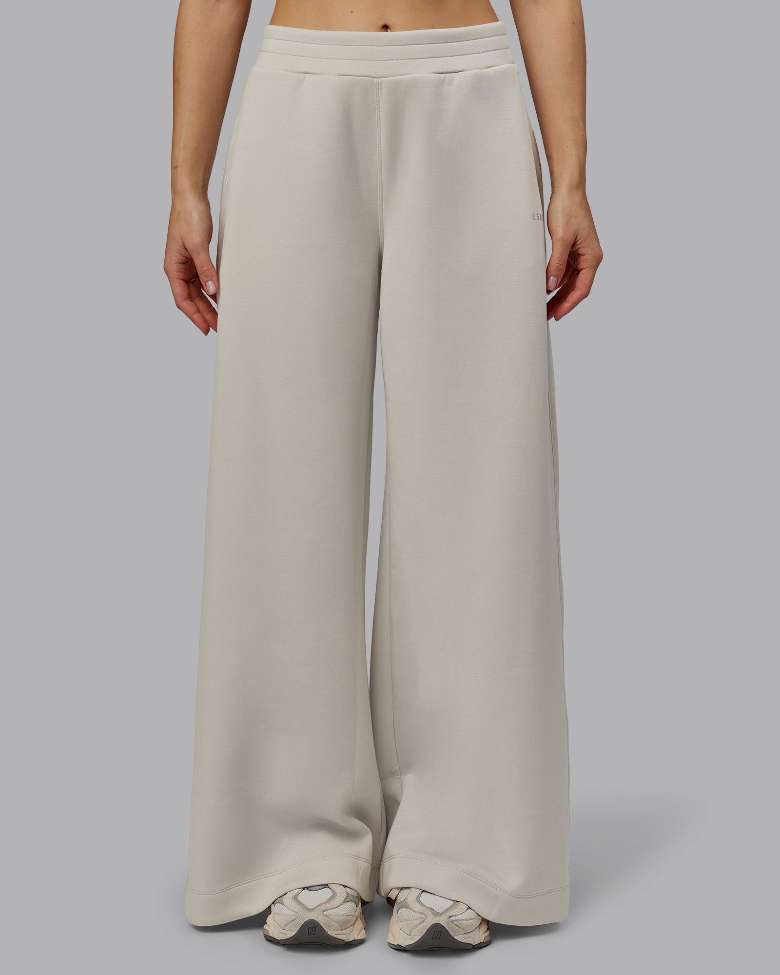 Woman wearing Elevate SoftTouch Wide Leg Pant - Shale Beige | Model:Emilie | Size:S