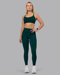 Woman wearing Elite High-Rise Full Length Legging Pockets - Dark Moss | Model:Halle | Size:S