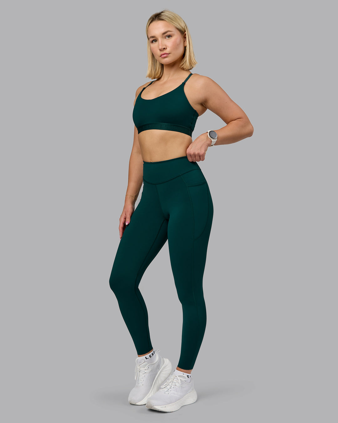 Woman wearing Elite High-Rise Full Length Legging Pockets - Dark Moss | Model:Halle | Size:S
