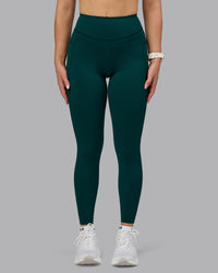 Woman wearing Elite High-Rise Full Length Legging Pockets - Dark Moss | Model:Halle | Size:S