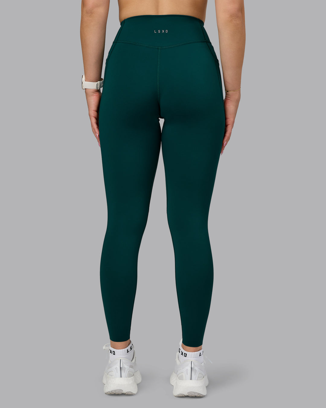 Woman wearing Elite High-Rise Full Length Legging Pockets - Dark Moss | Model:Halle | Size:S