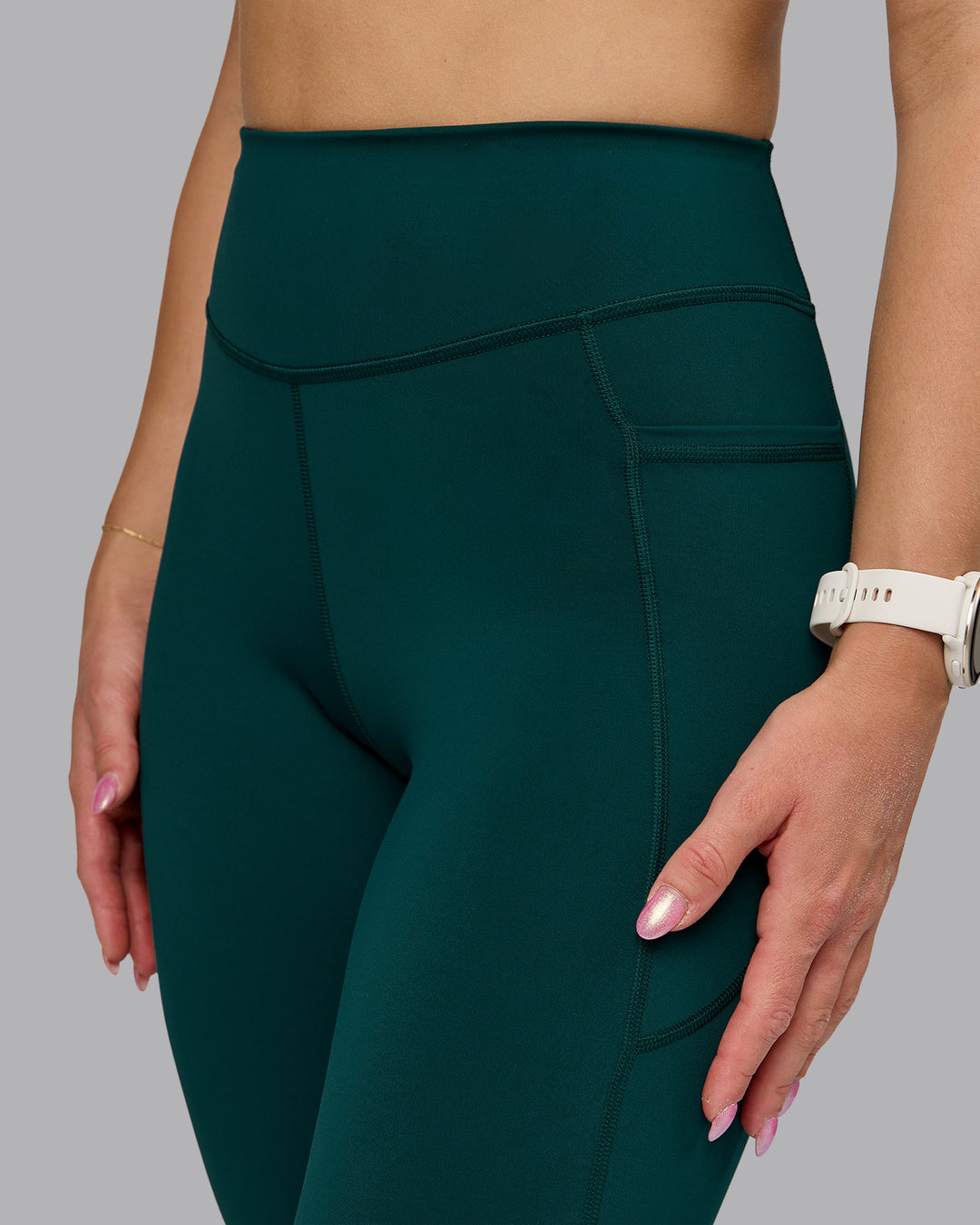 Woman wearing Elite High-Rise Full Length Legging Pockets - Dark Moss | Model:Halle | Size:S