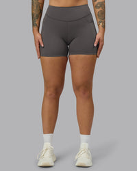Woman wearing Elite High-Rise 4" Short Pockets - Dark Storm | Model:Robyn | Size:S | Thumbnail Index: 0