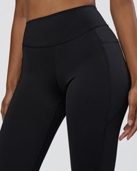 Woman wearing Elite High-Rise 7/8 Legging Pockets - Black | Model:Jordan | Size:S
