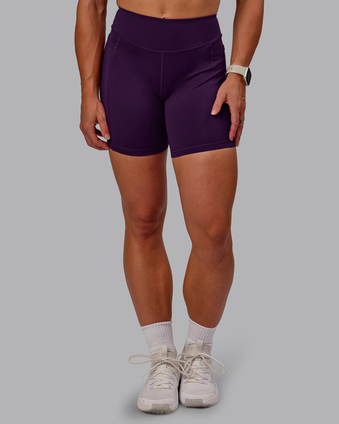 Woman wearing Elite High-Rise 6&quot; Short Pockets in Deep Purple | Size:S