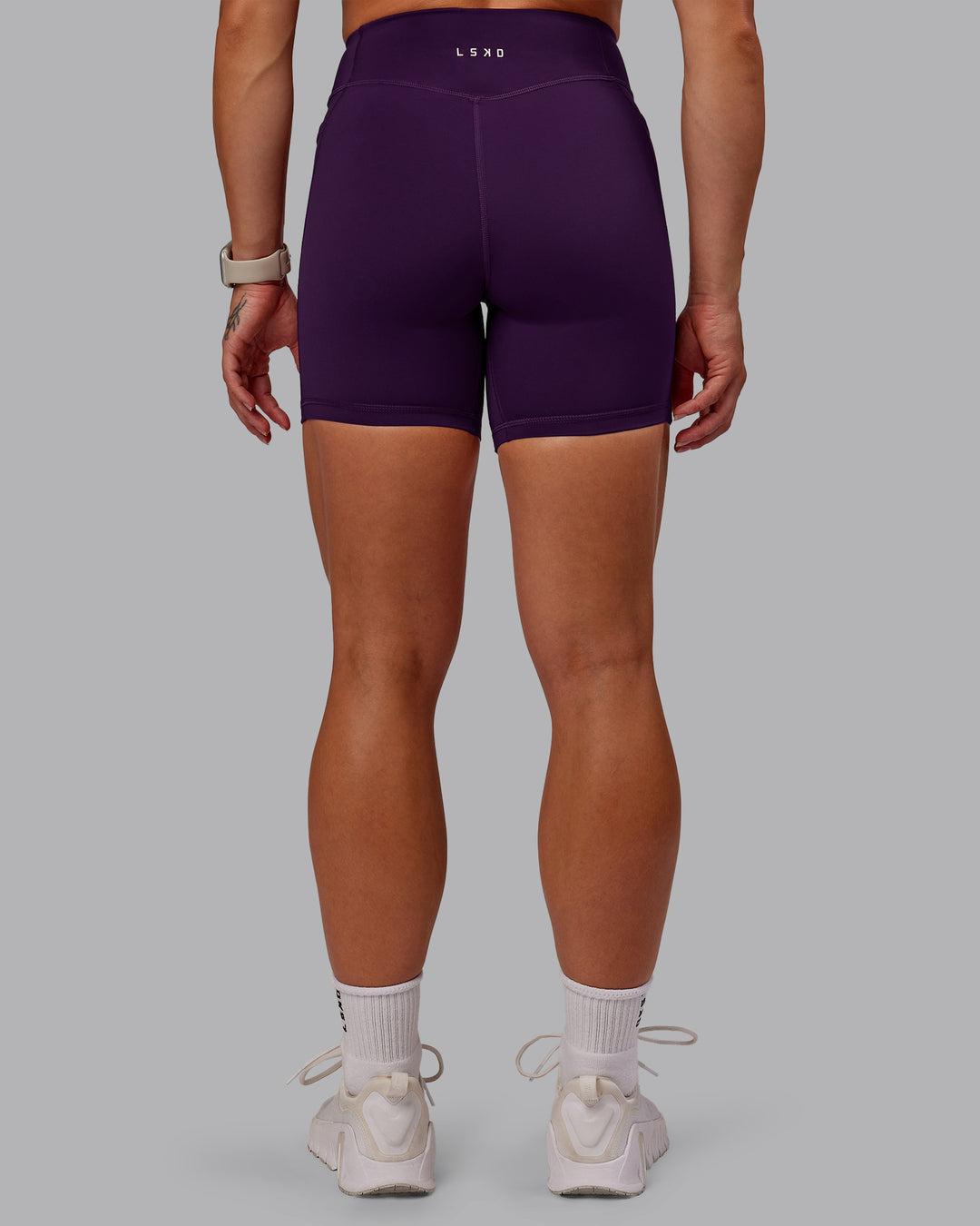 Woman wearing Elite High-Rise 6&quot; Short Pockets in Deep Purple | Size:S