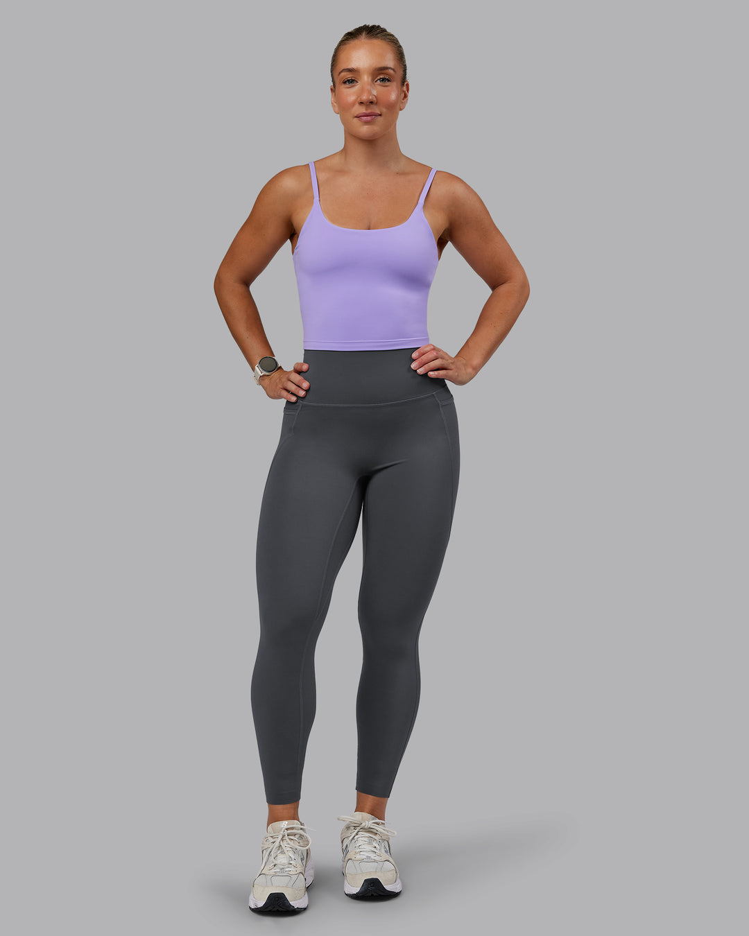 Woman wearing Elixir Ultra High-Rise 7/8 Legging Pockets - Dark Storm | Model:Lyss | Size:S