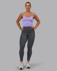 Woman wearing Elixir Ultra High-Rise 7/8 Legging Pockets - Dark Storm | Model:Lyss | Size:S