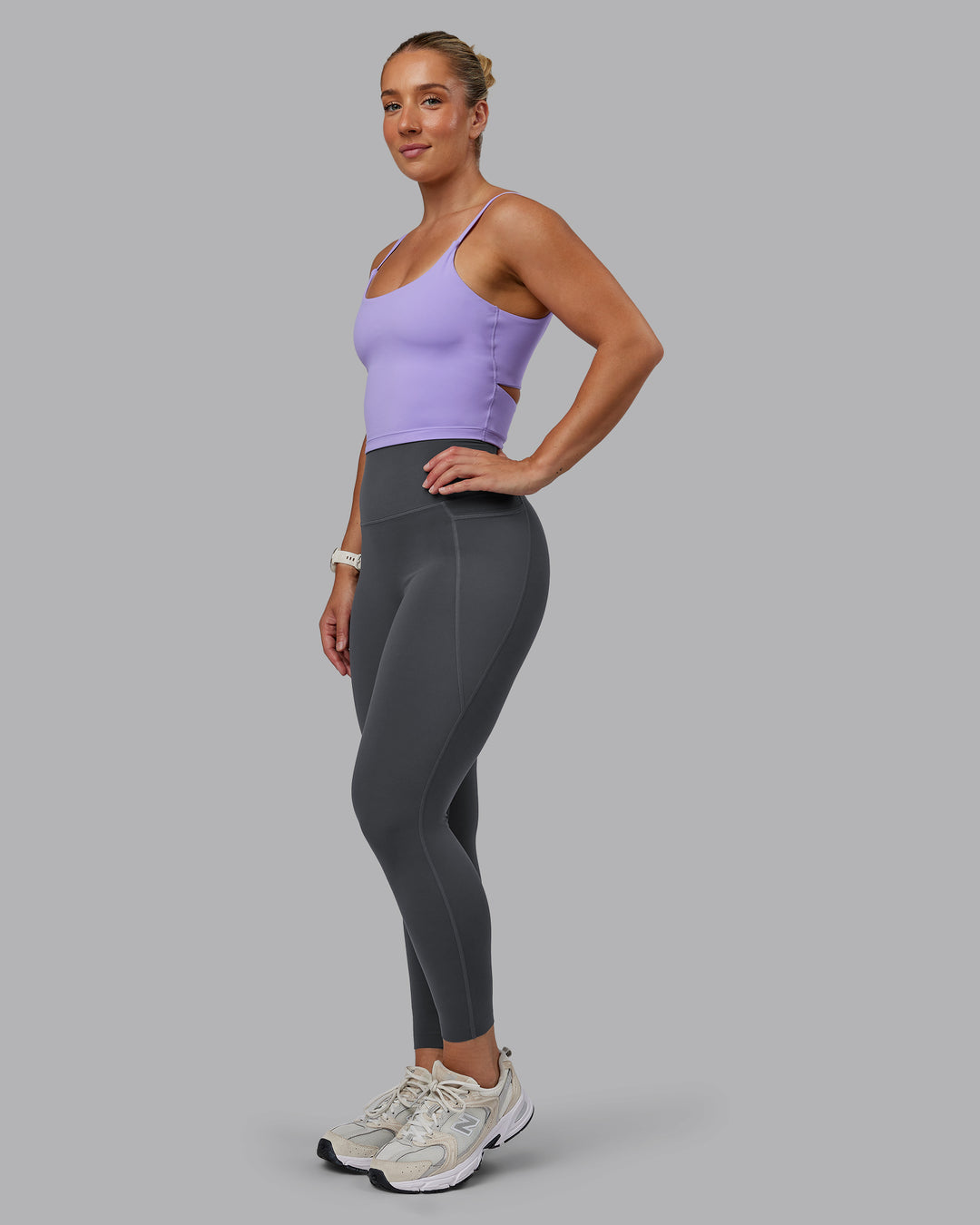Woman wearing Elixir Ultra High-Rise 7/8 Legging Pockets - Dark Storm | Model:Lyss | Size:S