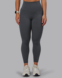 Woman wearing Elixir Ultra High-Rise 7/8 Legging Pockets - Dark Storm | Model:Lyss | Size:S