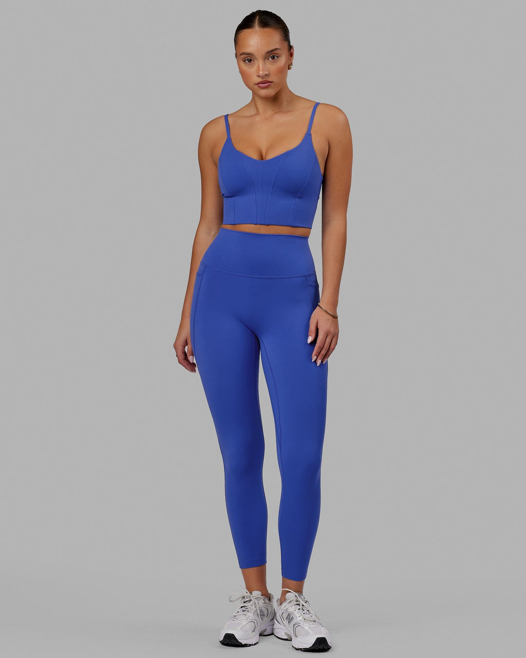 Woman wearing Elixir 7/8 Tights With Pockets - Power Cobalt