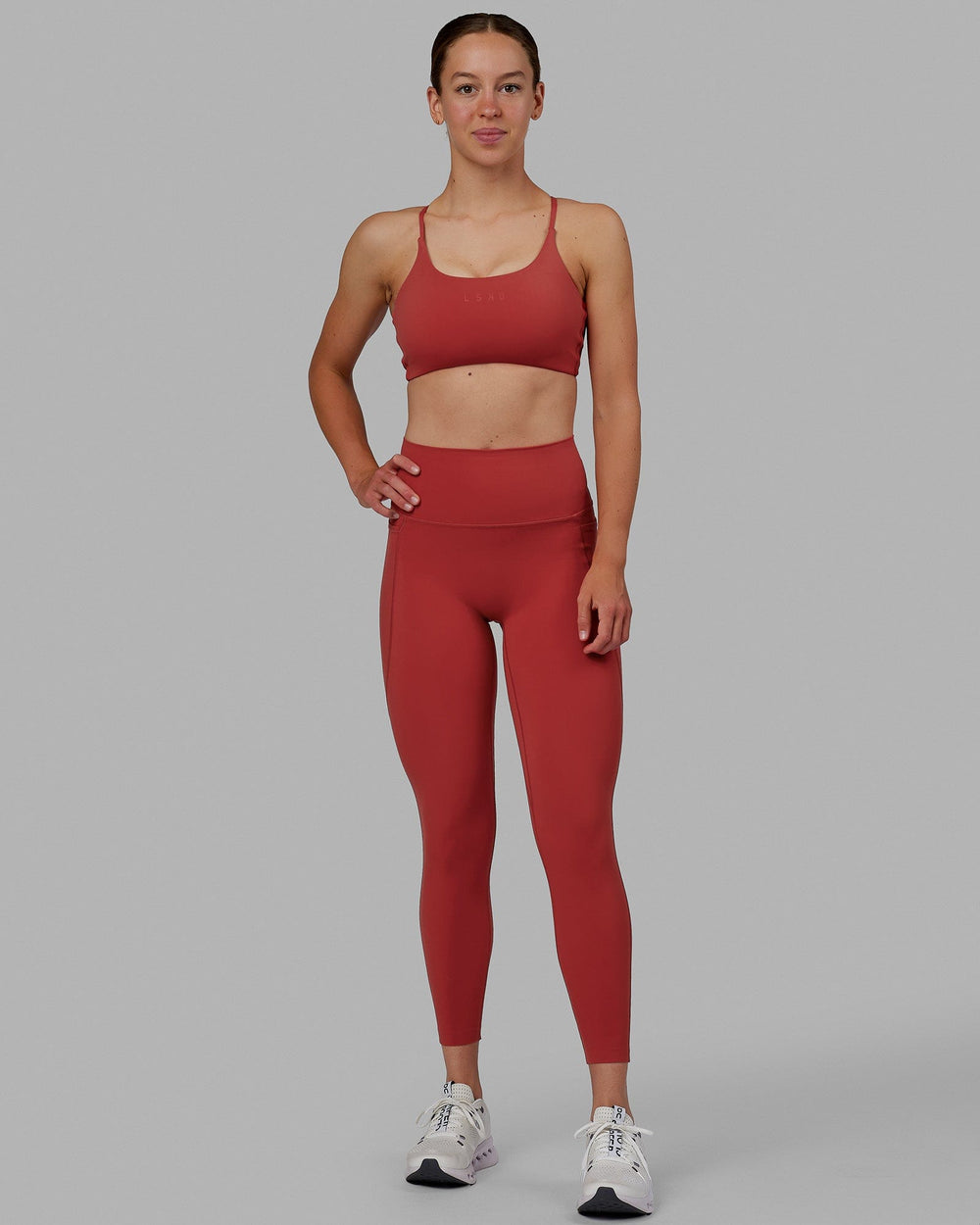 Woman wearing Elixir 7/8 Length Tights With Pockets - Cardinal