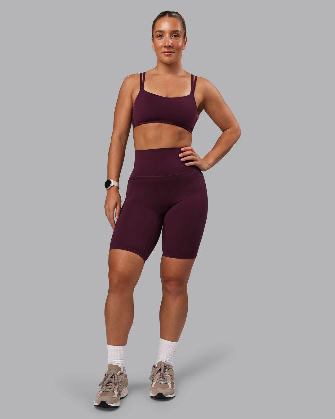 Woman wearing Elixir Ultra High-Rise 9&quot; Short Pockets - Cherry Lacquer | Model:Lyss | Size:S
