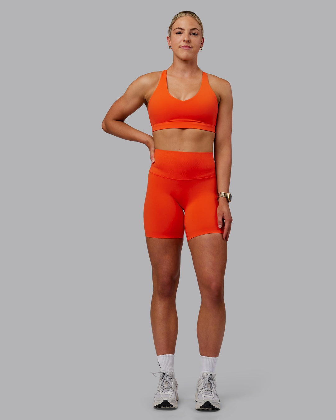 Woman wearing Elixir Ultra High-Rise Bonded Waistband 6" Short - Grenadine | Model:Caitlin | Size:S
