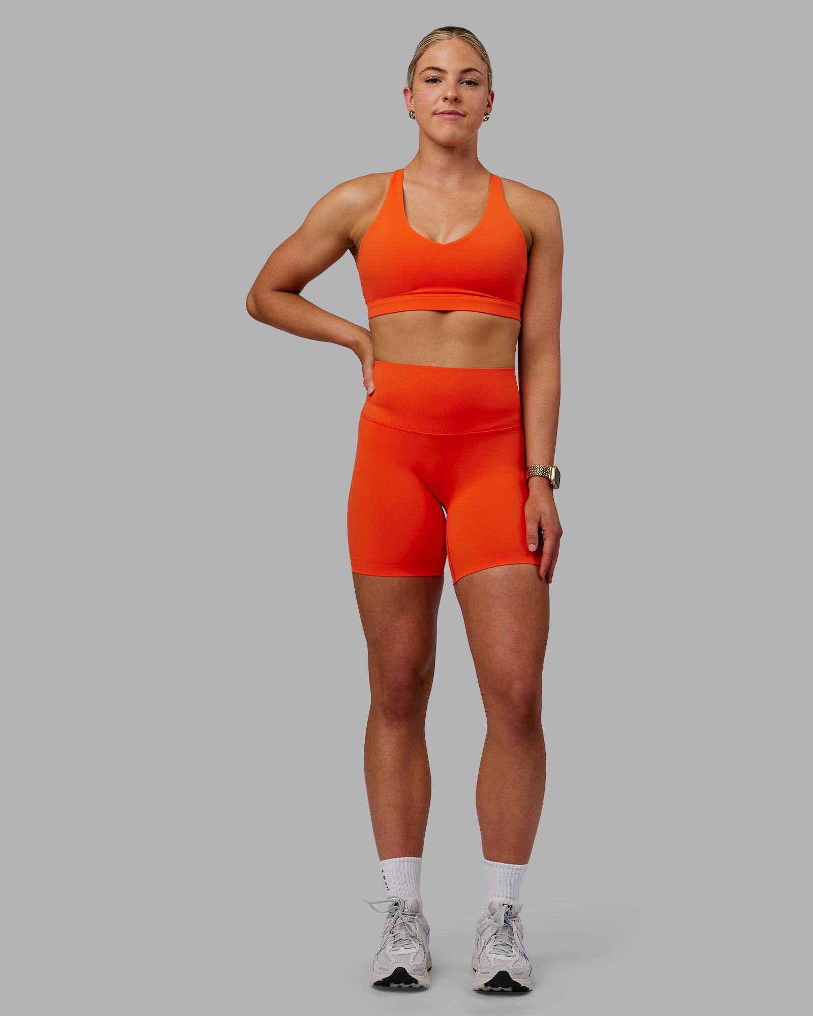 Woman wearing Elixir Ultra High-Rise Bonded Waistband 6" Short - Grenadine | Model:Caitlin | Size:S