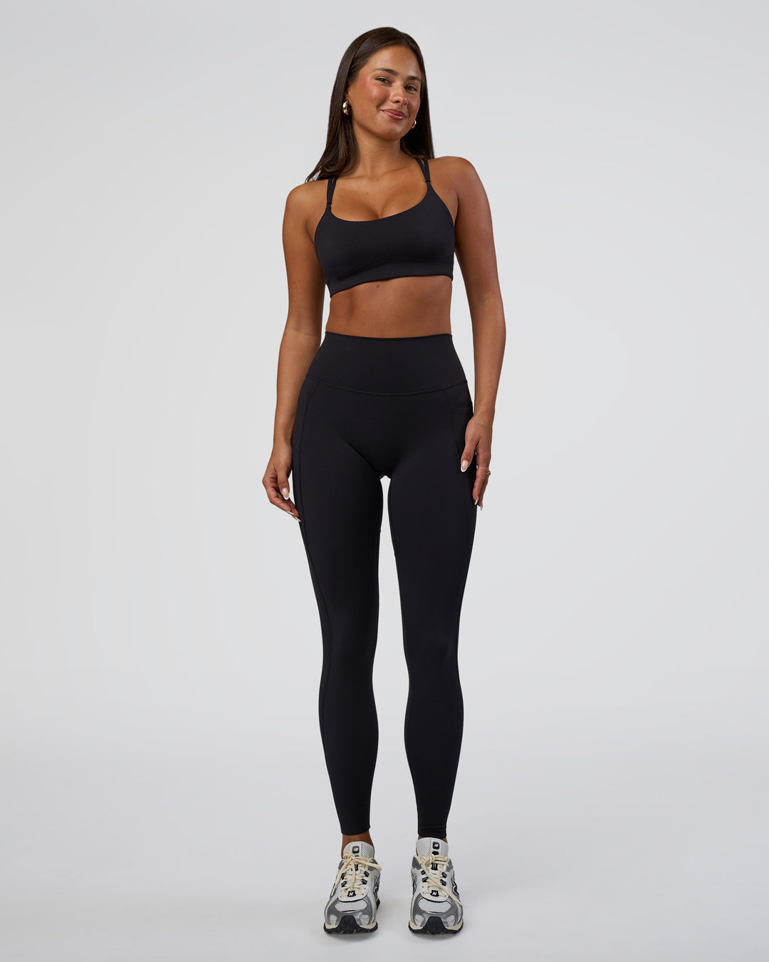 Woman wearing Elixir Defined High-Rise Full Length Legging Pockets - Black | Model:Bianca | Size:S
