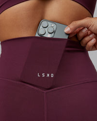 Woman wearing Elixir Ultra High-Rise Full Length Legging - Cherry Lacquer | Size:S