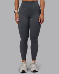 Woman wearing Elixir Ultra High-Rise Full Length Legging - Dark Storm | Size:S