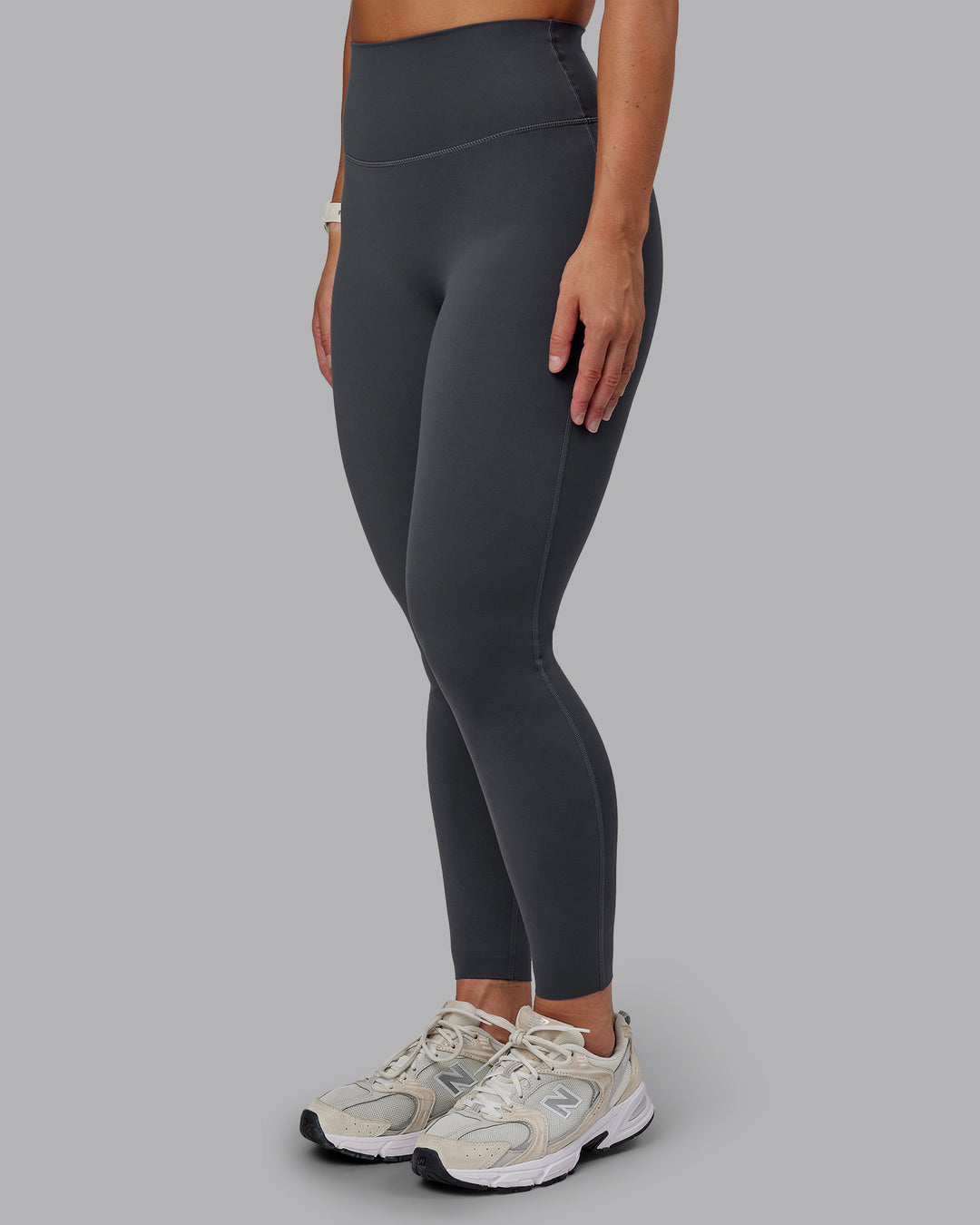 Woman wearing Elixir Ultra High-Rise Full Length Legging - Dark Storm | Size:S