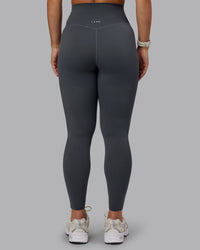 Woman wearing Elixir Ultra High-Rise Full Length Legging - Dark Storm | Size:S
