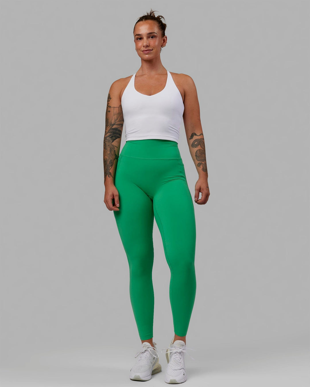 Woman wearing Elixir Ultra High-Rise Full Length Legging Pockets - Holly Green