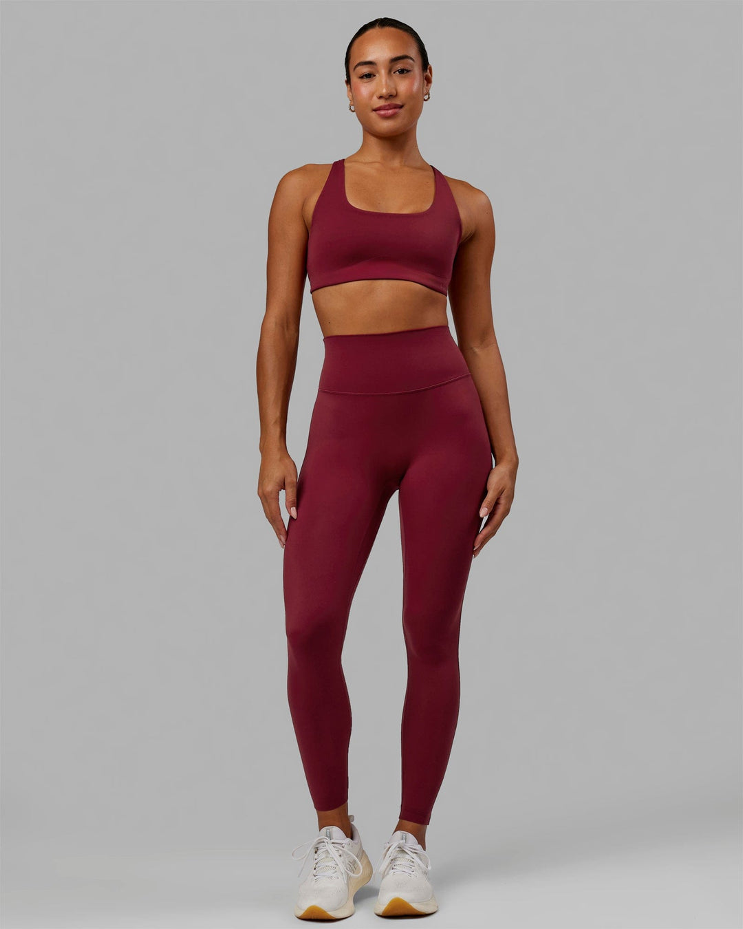 Woman wearing Elixir Full Length Tights - Cranberry