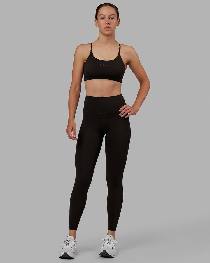 Woman wearing Elixir Full Length Tights With Pockets - Dark Walnut