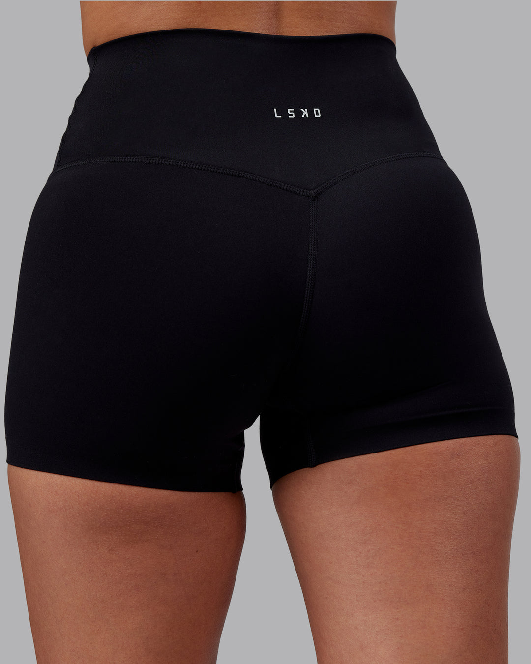 Woman wearing Elixir High-Rise 4&quot; Short - Black | Model:Rhiley | Size:S