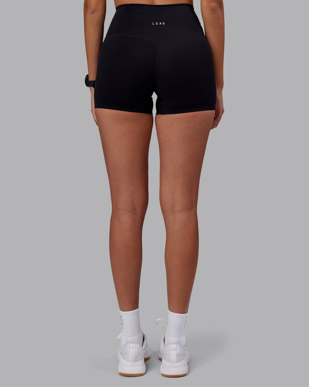 Woman wearing Elixir High-Rise 4&quot; Short - Black | Model:Rhiley | Size:S
