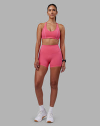 Woman wearing Elixir High-Rise 4" Short - Hot Pink | Model:Rhiley | Size:S