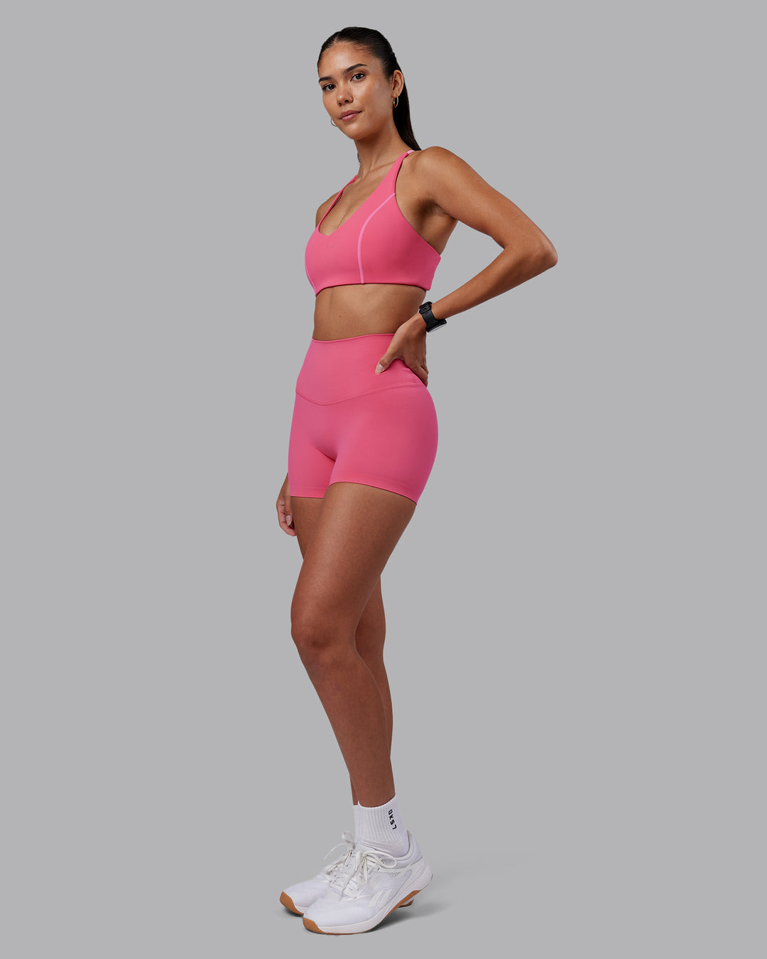 Woman wearing Elixir High-Rise 4&quot; Short - Hot Pink | Model:Rhiley | Size:S