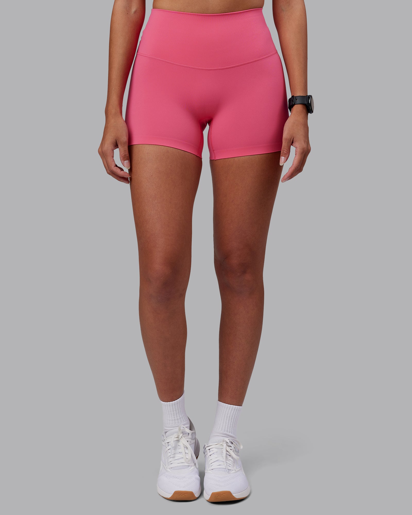 Woman wearing Elixir High-Rise 4" Short - Hot Pink | Model:Rhiley | Size:S