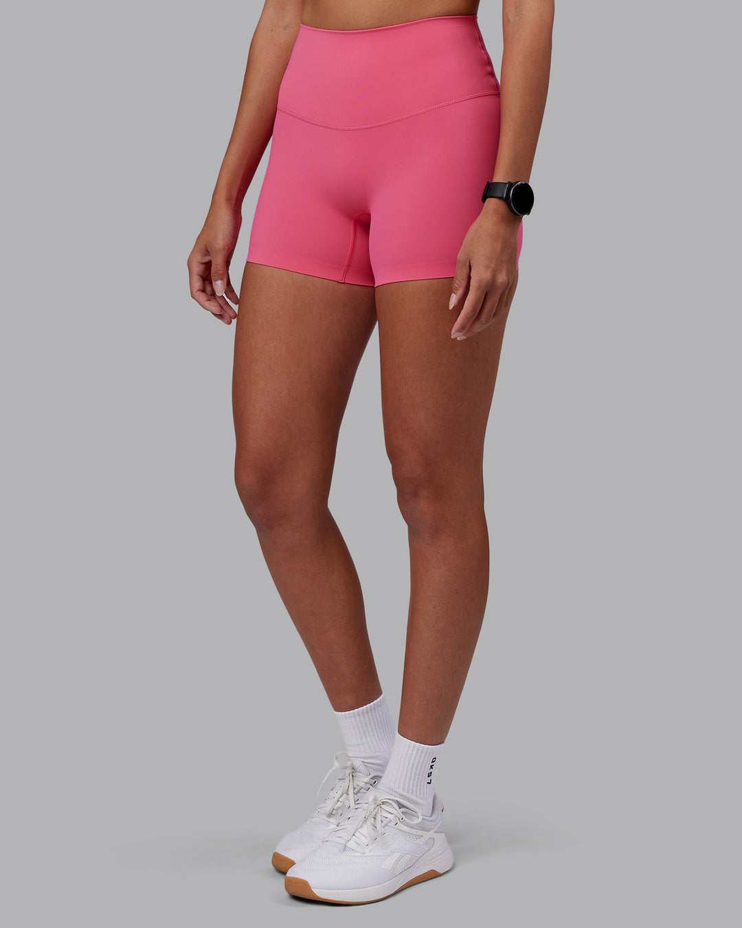 Woman wearing Elixir High-Rise 4&quot; Short - Hot Pink | Model:Rhiley | Size:S