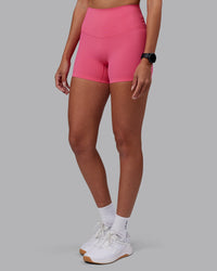 Woman wearing Elixir High-Rise 4" Short - Hot Pink | Model:Rhiley | Size:S