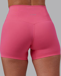Woman wearing Elixir High-Rise 4" Short - Hot Pink | Model:Rhiley | Size:S
